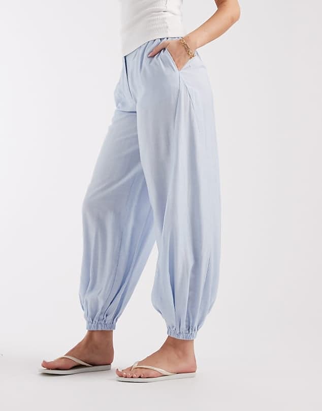 ASOS ASOS DESIGN Tailored balloon tie hem trouser in crinkle fabric — Soft powder blue trouser