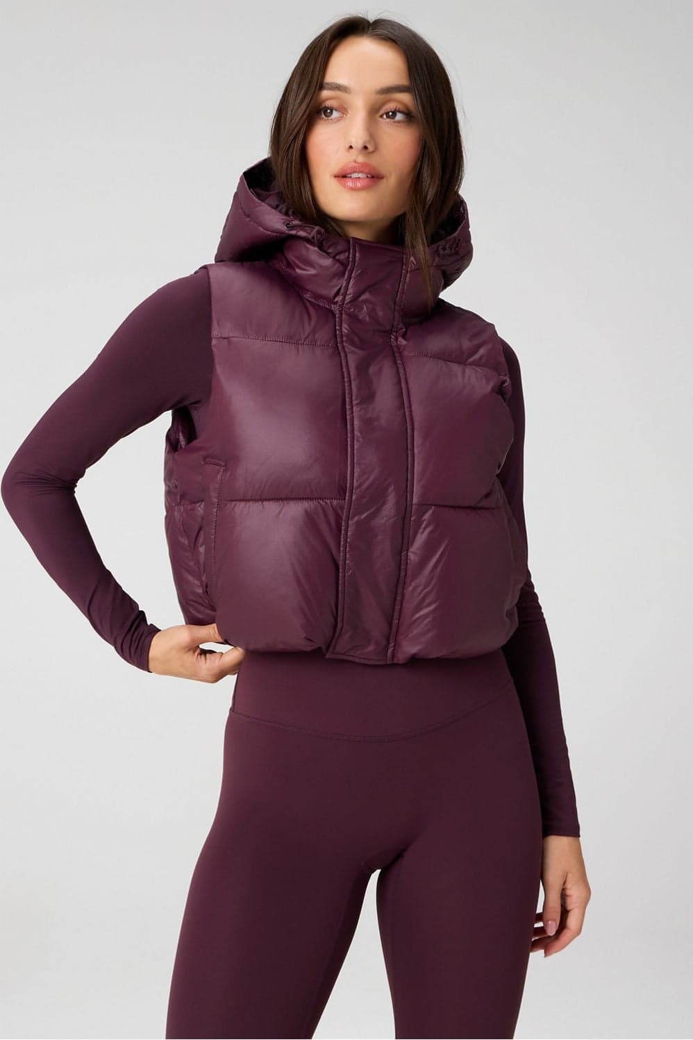 Fabletics Essential Shine Cropped Hooded Winter Puffer Jacket Vest — Deep wine red jacket — image 1 of 3